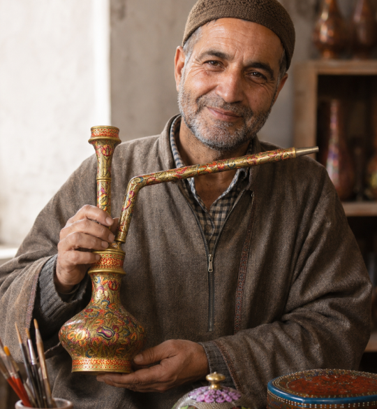 Kashmiri artisan showcasing traditional handcrafted work