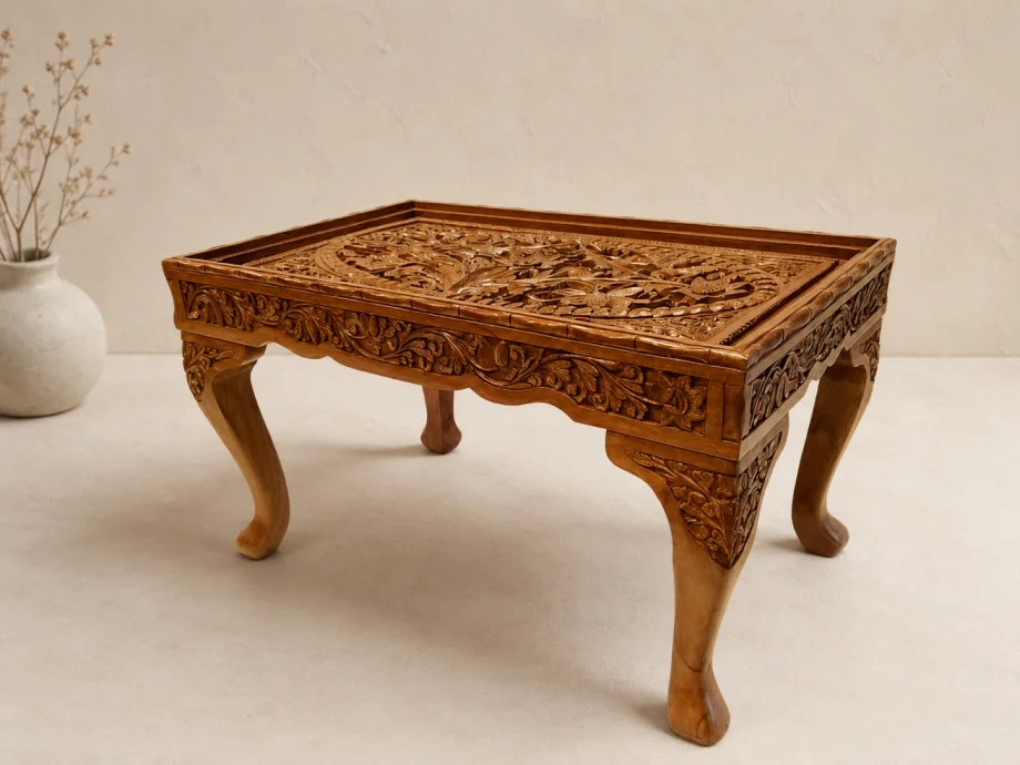 Hand-carved Kashmiri wooden table featuring intricate floral motifs, detailed craftsmanship, and an elegant rectangular design.