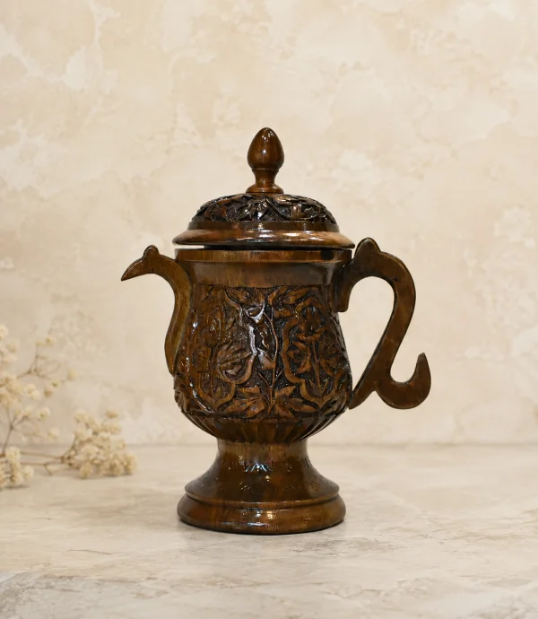 Traditional Kashmiri samovar with ornate engraved floral patterns, decorative handles, and a handcrafted metallic finish.