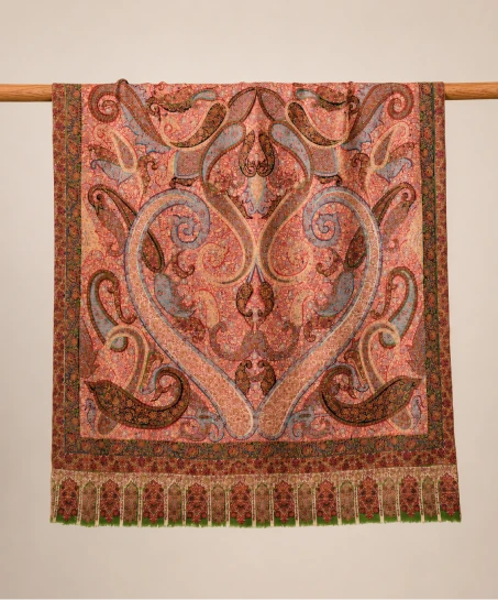 Handcrafted Kashmiri Kani shawl displayed flat, showcasing an intricate paisley design, floral woven border, multicolor pattern, and decorative fringed tassels.