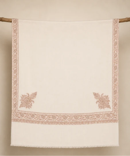 Handcrafted Kashmiri embroidered shawl displayed flat, featuring an ivory body with delicate floral embroidered borders, corner motifs, and finely finished fringed edges.