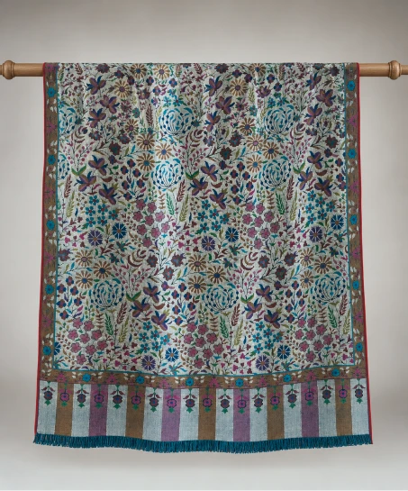 Handcrafted Kashmiri woven shawl displayed flat, featuring intricate floral patterns, multicolor woven borders, striped detailing, and finely finished tasseled fringes.